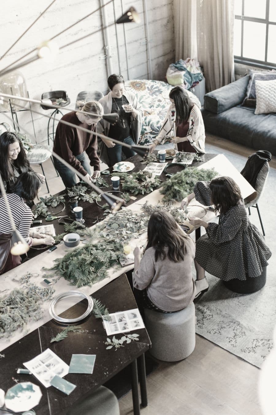A community workshop around a long table